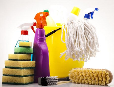 Cleaner inspecting a carpeted room for hazards