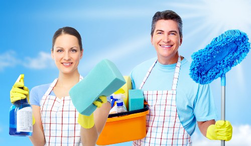 Technician wearing PPE during professional carpet cleaning